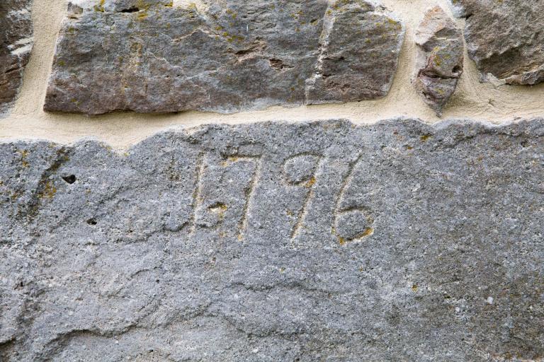 date on barn chiseled in the stone