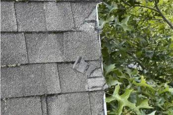 Broken tabs on a asphalt shingled roof