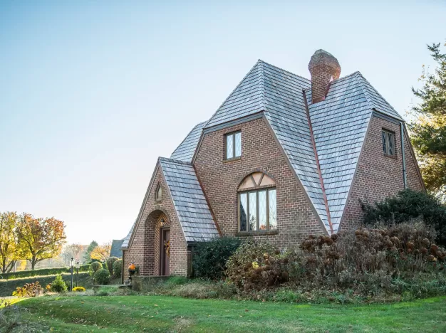 A house with a cedar shake roof.